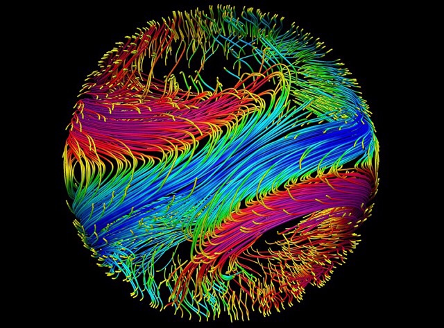 Night-side view of magnetic field lines in a simulation of a "hot Jupiter" exoplanet. Simulations like these help researchers better understand the interior dynamics of these planets and learn more about how they may have formed. Magenta indicates magnetic fields with positive polarity, and blue indicates fields with negative polarity. Tamara Rogers, Jess Vriesema, University of Arizona
