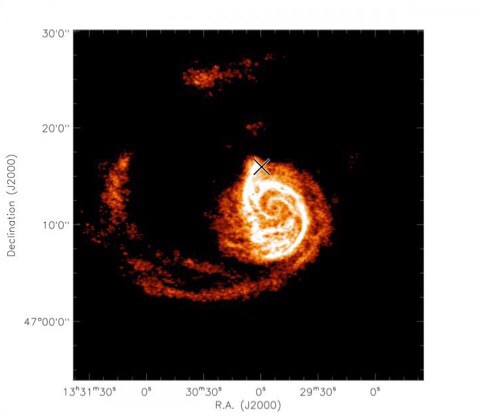 CAPTION This image, captured by the Very Large Array, shows the atomic hydrogen distribution of the Whirlpool Galaxy. The "X" marks the dwarf companion satellite. Dynamical simulations can recover its location and mass. CREDIT VLA, Chakrabarti et al. 2011