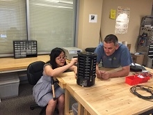 Doctoral student Yan Zhu (left) and Eamonn Keogh, professor of computer science and engineering, adjust a mosquito trap designed by researchers at UCR and Microsoft.