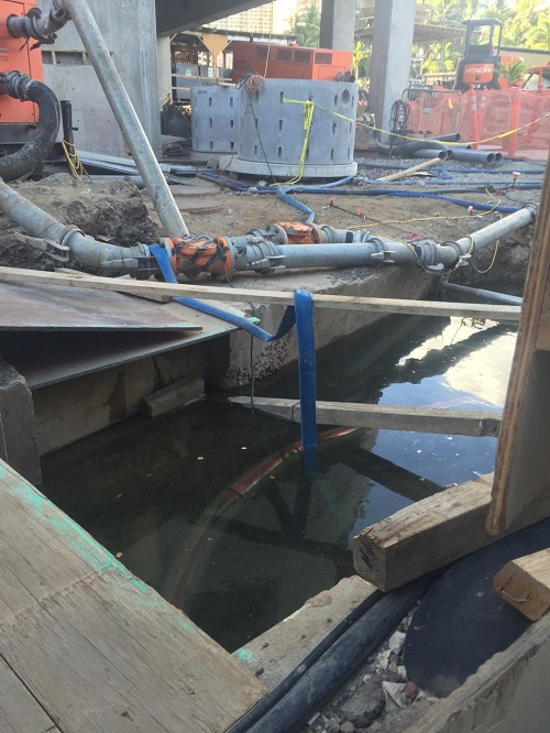 CAPTION This construction trench in Waikiki shows that the water table is nearly at the ground surface at high tide.