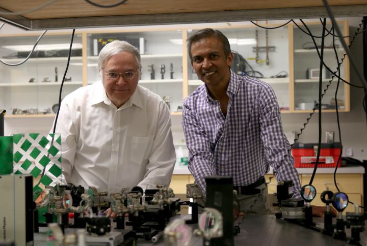 University of Utah physics and astronomy Distinguished Professor Valy Vardeny, left, and University of Utah electrical and computer engineering professor Ajay Nahata have discovered that a special kind of perovskite, a combination of an organic and inorganic compound that has the same structure as the original mineral, can be layered on a silicon wafer to create a vital component for the communications system of the future. That system would use the terahertz spectrum, the next generation of communications bandwidth that uses light instead of electricity to shuttle data, allowing cellphone and internet users to transfer information a thousand times faster than today. CREDIT Dan Hixon/College of Engineering
