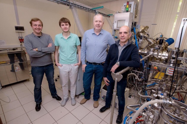 CAPTION (From left) Dmitry Kuzmichev, Konstantin Egorov, Andrey Markeev, and Yury Lebedinskiy posing next to the atomic layer deposition apparatus at the Center of Shared Research Facilities, MIPT
