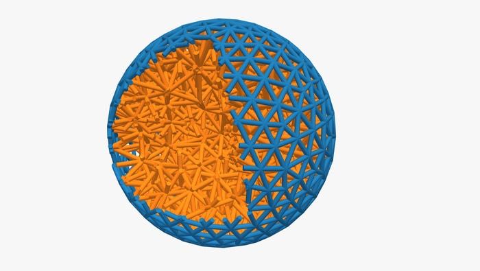 Wrapping an elastic ball (orange) in a layer of tiny robots (blue) allows researchers to program shape and behaviour.  CREDIT Jack Binysh