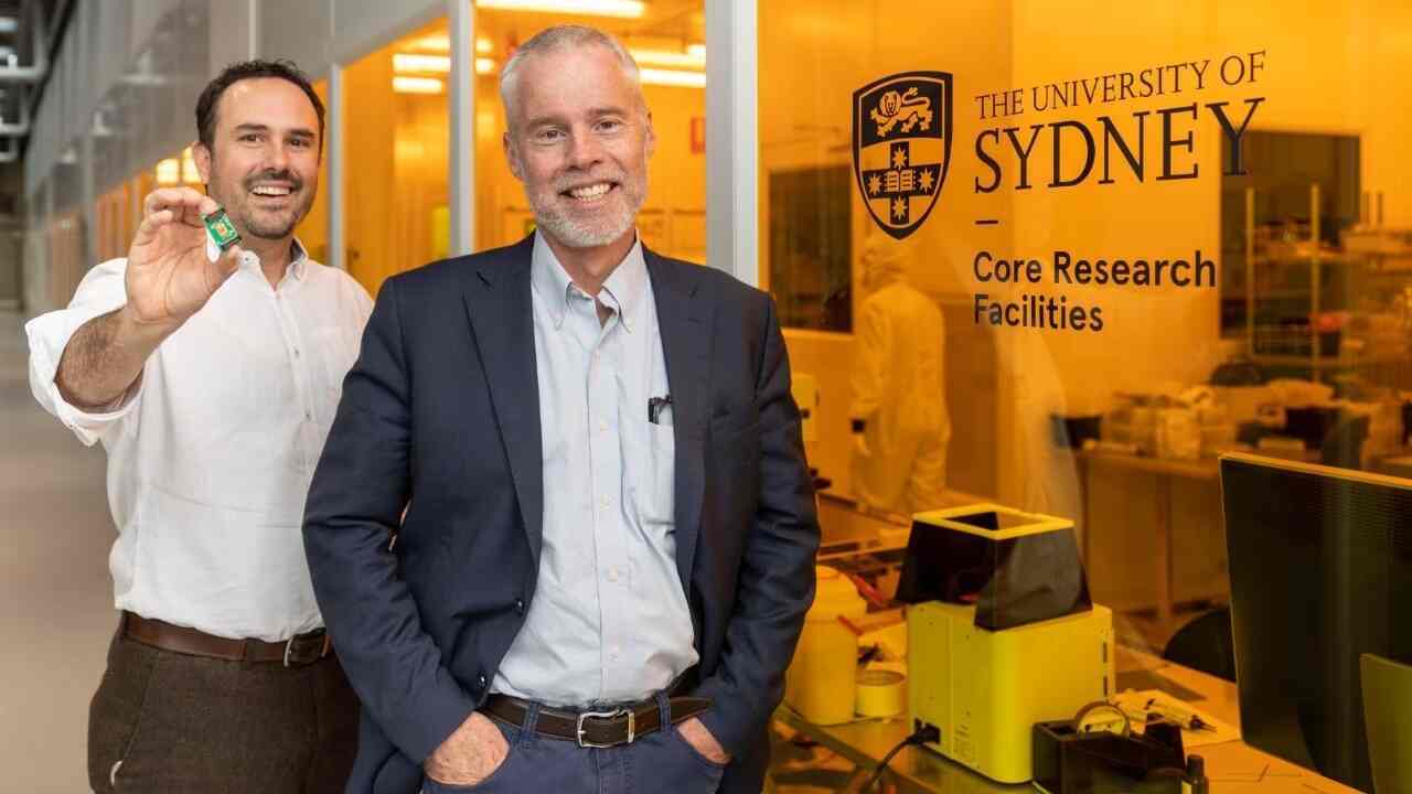 Dr Alvaro Casas Bedoya, holding the new chip, with Professor Ben Eggleton in the Sydney Nanoscience Hub. Photo: Stefanie Zingsheim