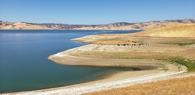 Water in the San Luis reservoir, which was constructed as a storage reservoir in California’s Central Valley. Groundwater in this region may never be able to recover from past and future droughts, according to new research published in Water Resources Research. Credit: Fredrick Lee