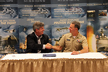 Dan Hasler (left), president and chief entrepreneurial officer of Purdue Research Foundation, shakes hands with Capt. Jeffrey "J.T." Elder, commanding officer of Naval Surface Warfare Center - Crane Division (NSWC Crane), during an Aug. 22 event. NSWC Crane and Purdue have signed a partnership intermediary agreement that will showcase both organizations' intellectual property to expedite and support the move of innovations to the public. Dan Hasler (left), president and chief entrepreneurial officer of Purdue Research Foundation, shakes hands with Capt. Jeffrey "J.T." Elder, commanding officer of Naval Surface Warfare Center - Crane Division (NSWC Crane), during an Aug. 22 event. NSWC Crane and Purdue have signed a partnership intermediary agreement that will showcase both organizations' intellectual property to expedite and support the move of innovations to the public.