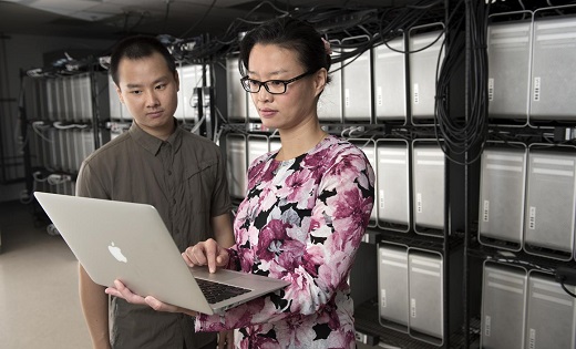 CAPTION Daphne Yao, Virginia Tech associate professor of computer science in the College of Engineering, and her doctoral student Xiaokui Shu check their data for a new piece of software called the program anomaly detection approach. CAPTION Daphne Yao, Virginia Tech associate professor of computer science in the College of Engineering, and her doctoral student Xiaokui Shu check their data for a new piece of software called the program anomaly detection approach.