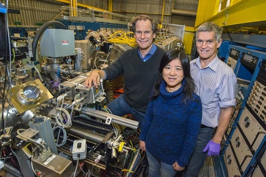 CAPTION From left are, Berkeley Lab scientists Thomas Schenkel, Qing Ji and Peter Seidl at the NDCX-II (Neutralized Drift Compression Experiment II), which produces powerful ion beams. Researchers are exploring how to use NDCX-II to process exotic materials, like the silicon-bismuth sample used in a recent microwave-based experiment relevant to quantum computing. CREDIT Credit: Roy Kaltschmidt/Berkeley Lab CAPTION From left are, Berkeley Lab scientists Thomas Schenkel, Qing Ji and Peter Seidl at the NDCX-II (Neutralized Drift Compression Experiment II), which produces powerful ion beams. Researchers are exploring how to use NDCX-II to process exotic materials, like the silicon-bismuth sample used in a recent microwave-based experiment relevant to quantum computing. CREDIT Credit: Roy Kaltschmidt/Berkeley Lab