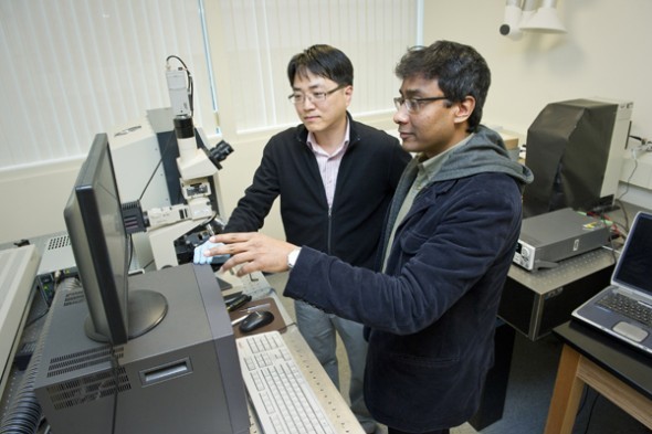 Swastik Kar (right), assistant professor of physics at Northeastern University, and Yung Joon Jung (left), associate professor of mechanical and industrial engineering at Northeastern University, use a Raman Spectrometer to characterize the assembly of a carbon nanotube. The pair recently received National Science Foundation grant to explore the phenomenon of the photoswitch. Swastik Kar (right), assistant professor of physics at Northeastern University, and Yung Joon Jung (left), associate professor of mechanical and industrial engineering at Northeastern University, use a Raman Spectrometer to characterize the assembly of a carbon nanotube. The pair recently received National Science Foundation grant to explore the phenomenon of the photoswitch.