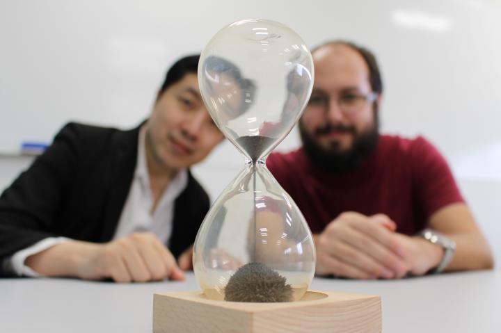 Just as an hourglass needs finer sand to make a more precise measurement of time, a classical computer needs finer time-steps, and in turn more memory, to make more accurate simulations. Quantum effects can provide a work-around, predict researchers Mile Gu (left) and Thomas Elliott (right) in Singapore. Just as an hourglass needs finer sand to make a more precise measurement of time, a classical computer needs finer time-steps, and in turn more memory, to make more accurate simulations. Quantum effects can provide a work-around, predict researchers Mile Gu (left) and Thomas Elliott (right) in Singapore.