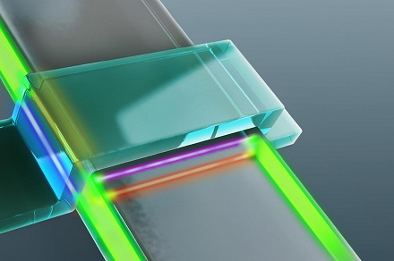 Rendering of the electronic device in which Majorana particles were observed. The device is made up of a superconductor (blue bar) and a magnetic topological insulator (gray strip). The Majorana particles result in transport channels (shown in red, pink, blue and yellow) in the electronic device. Rendering of the electronic device in which Majorana particles were observed. The device is made up of a superconductor (blue bar) and a magnetic topological insulator (gray strip). The Majorana particles result in transport channels (shown in red, pink, blue and yellow) in the electronic device.