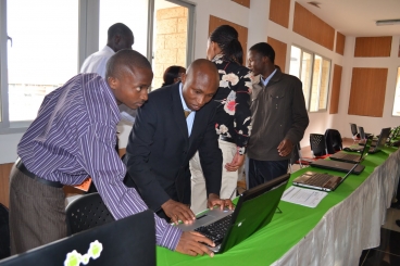 During the entrepreneurship competition that capped off AITI's course in Kenya last summer, students demonstrated the mobile applications around which they hoped to build companies. Photo: Brian Sangudi During the entrepreneurship competition that capped off AITI's course in Kenya last summer, students demonstrated the mobile applications around which they hoped to build companies. Photo: Brian Sangudi