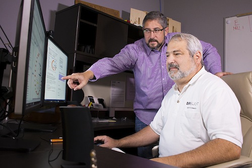 Cybersecurity software developed at Pacific Northwest National Laboratory learns about a company to better protect it. Called CHAMPION, the software can reason like an analyst to determine if network activity is suspicious. It then issues an alert in near-real-time. PNNL Shawn Hampton (left), Champion Technology Company's Ryan Hohimer (right) and their teams received an FLC Award for developing this technology.