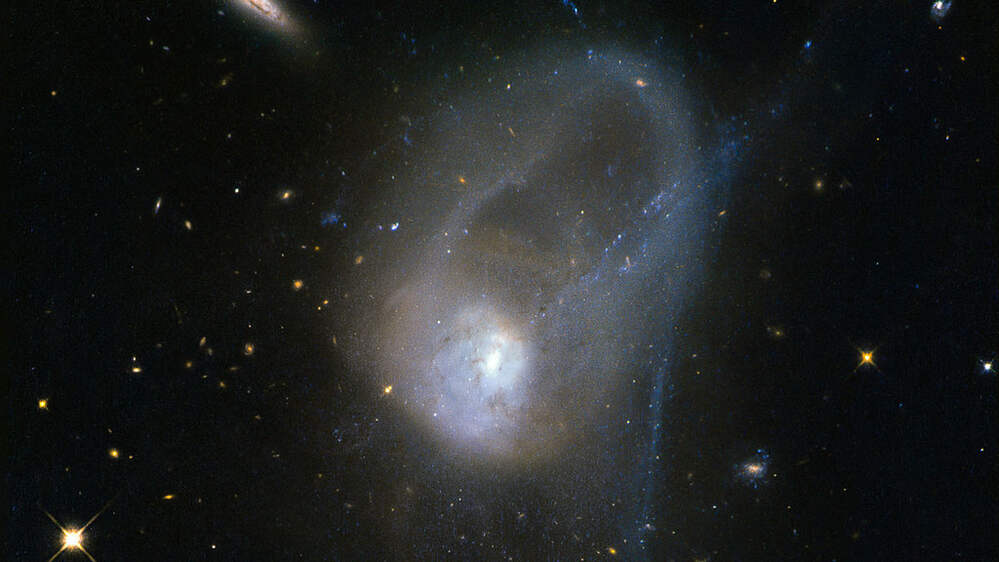 A pair of disc galaxies in the late stages of a merger. Credit: NASA. A pair of disc galaxies in the late stages of a merger. Credit: NASA.