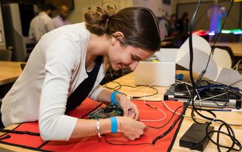 The RED projects will build upon successful innovations in the introductory and capstone years to improve the entire undergraduate experience, including technical core courses during sophomore and junior years, extracurricular professional activities and student transfer from two- to four-year institutions. The awards also may support faculty development, faculty incentives and inclusive academic cultures. Shown here is a University of San Diego student working circuit board project. USD is one of six engineering departments chosen for a RED award.