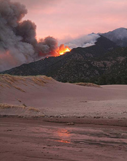 On June 6, 2010, lightning ignited the Medano Fire in Great Sand Dunes National Park in Colorado. By the time this image was taken on June 23, more than 5,000 acres had burned. (©UCAR. Photo by David Hosansky. Scientists update daylong predictions of long-lived wildfires