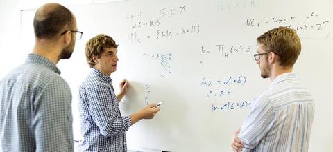 Assistant Professors Aws Albarghouthi and Loris D'Antoni, along with graduate student David Merrell, discuss their work. All photos by Sarah Morton, UW-Madison College of Letters & Science. Assistant Professors Aws Albarghouthi and Loris D'Antoni, along with graduate student David Merrell, discuss their work. All photos by Sarah Morton, UW-Madison College of Letters & Science.