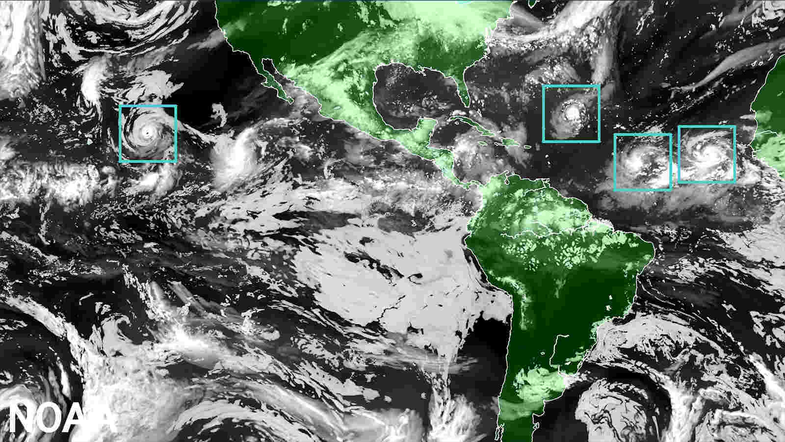 The Hurricane Analysis and Forecast System (HAFS) “moving nest" Model. Global map showcasing land mass in green and water in black, clouds in white and tropical storms outlined in a green boxes representing the moving nest model. (Image credit: NOAA)