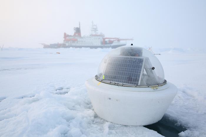 Scientists install buoys on an ice floe in the Central Arctic Ocean at the end of the MOSAiC leg 5 with RV Polarstern in September 2020. The buoys are working as an autonomous bio-physical observatory on sea ice and in the ocean. The observatory consisted, among other components, of an Acoustic Zooplankton and Fish Profiler (AZFP) measuring acoustic backscatter in the top 50 m of the ocean, a radiation station equipped with hyperspectral light sensors measuring irradiance at the ice underside between 350 and 920 nm25, and a CTD buoy (conductivity, temperature, depth). CREDIT Alfred Wegener Institute / Folke Mehrtens images/Low-Res_20200912_MOSAiCleg5_FolkeMehrtens_074_e85ac.jpg