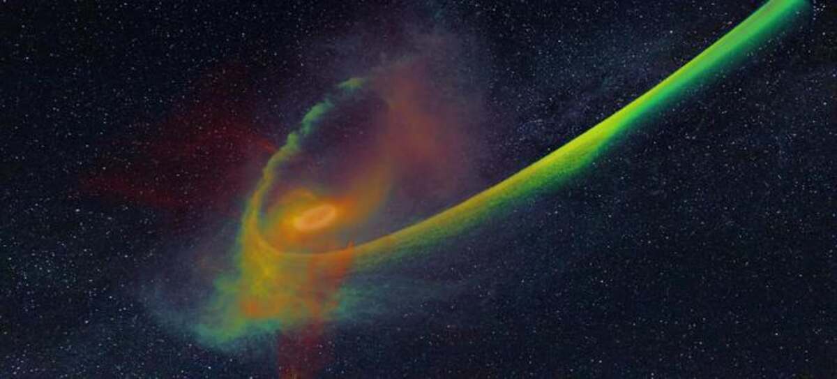 In the image provided, we can see a star that is currently in the process of being disrupted by a supermassive black hole. As the star passes by the black hole, the tidal force of the black hole tears apart the star. This results in half of the star being flung away into space while the other half falls back towards the black hole. The simulation carried out by Steinberg and Stone shows the density of the infalling half in green-blue color, as well as the heat generated by the shocks in white-red color. The original image and research are credited to Elad Steinberg. In the image provided, we can see a star that is currently in the process of being disrupted by a supermassive black hole. As the star passes by the black hole, the tidal force of the black hole tears apart the star. This results in half of the star being flung away into space while the other half falls back towards the black hole. The simulation carried out by Steinberg and Stone shows the density of the infalling half in green-blue color, as well as the heat generated by the shocks in white-red color. The original image and research are credited to Elad Steinberg.