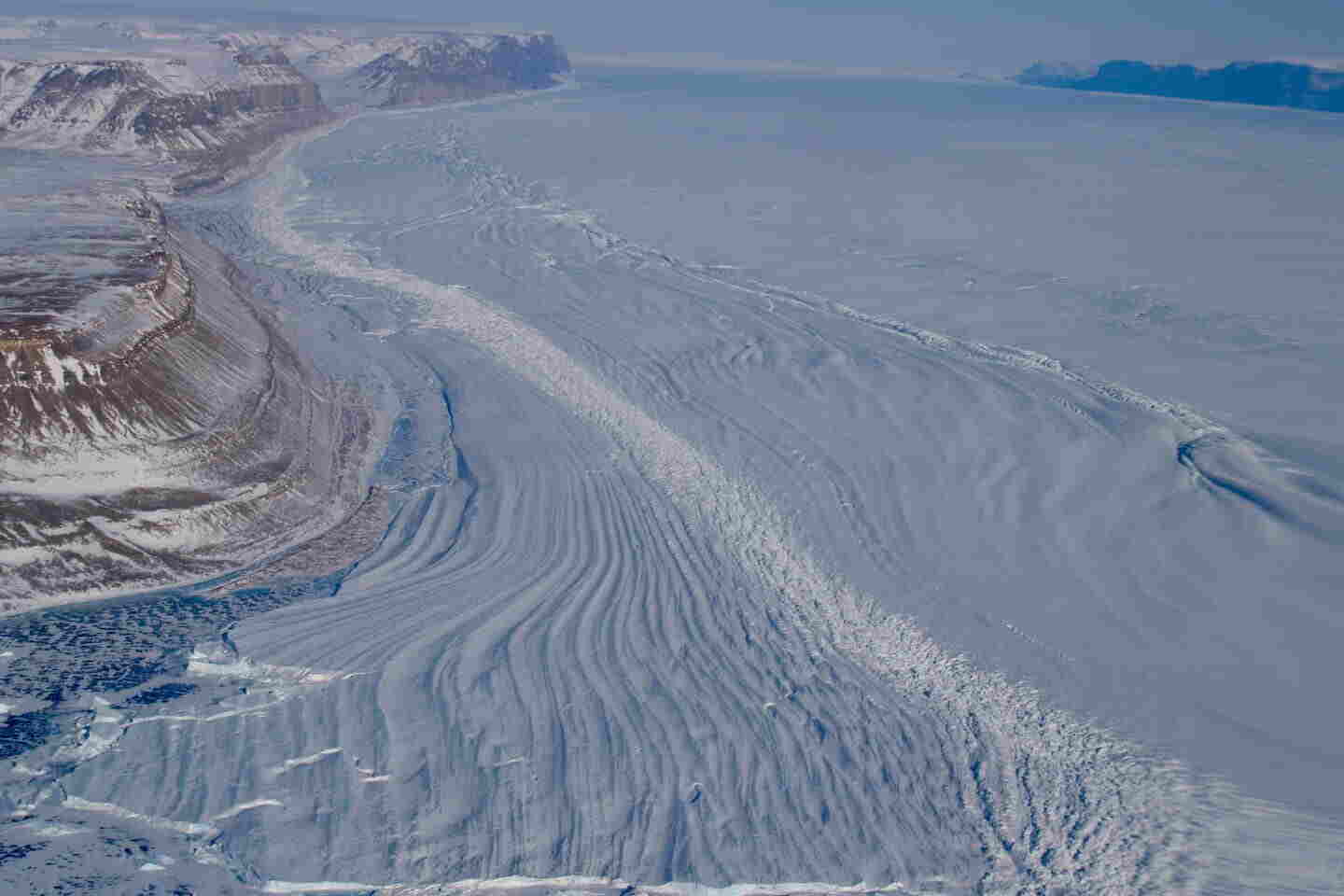 The Petermann Glacier, which accounts for about 4% of the Greenland Ice Sheet, is moving towards the Arctic Ocean. A recent study, which involved observations and supercomputer modeling, has shown that the glacier is more susceptible to warm ocean water intrusion underneath it than previously thought. This can lead to increased melting and potentially worsen future sea level rise. The study was conducted by Eric Rignot from UCI. The Petermann Glacier, which accounts for about 4% of the Greenland Ice Sheet, is moving towards the Arctic Ocean. A recent study, which involved observations and supercomputer modeling, has shown that the glacier is more susceptible to warm ocean water intrusion underneath it than previously thought. This can lead to increased melting and potentially worsen future sea level rise. The study was conducted by Eric Rignot from UCI.
