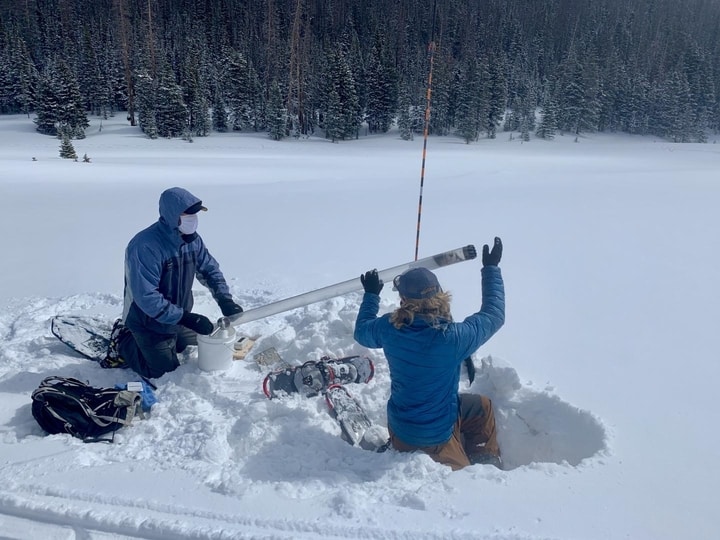Randall Bonnell and Lucas Zeller, graduate students at Colorado State University, collect a snow-water equivalent core sample at the site in Cameron Pass, Colorado.  CREDIT Courtesy of Dan McGrath, Colorado State University