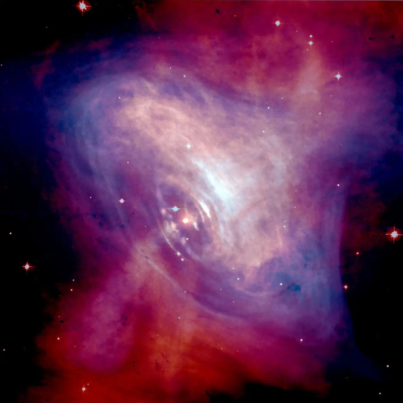 The Crab Nebula – a remnant of a supernova explosion which in its center contains a pulsar. The pulsar makes the ordinary matter in the form of gas in the nebula light up. As the researchers have now shown, it may do the same with dark matter in the form of axions, leading to a subtle additional glow that can be measured. Image: NASA/CXC/ASU/J. Hester et al. The Crab Nebula – a remnant of a supernova explosion which in its center contains a pulsar. The pulsar makes the ordinary matter in the form of gas in the nebula light up. As the researchers have now shown, it may do the same with dark matter in the form of axions, leading to a subtle additional glow that can be measured. Image: NASA/CXC/ASU/J. Hester et al.
