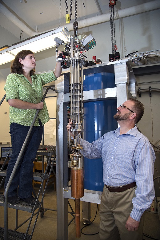 Purdue University professor Gábor Csáthy and graduate student Katherine Schreiber inspect equipment used to cool samples to near absolute zero. The equipment was used in Purdue-led research that led to the observation of an unexpected phase transition in an ultrapure material. (Purdue University photo/Mark Simons) Purdue University professor Gábor Csáthy and graduate student Katherine Schreiber inspect equipment used to cool samples to near absolute zero. The equipment was used in Purdue-led research that led to the observation of an unexpected phase transition in an ultrapure material. (Purdue University photo/Mark Simons)