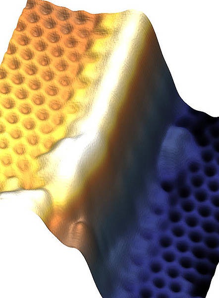 Bismuthene film interrupted at a step in the silicon carbide substrate viewed through a scanning tunnelling microscope. The film areas inevitably end at the substrate step and a conducting edge channel (white) occurs. Würzburg physicists make new material work for breakthrough in spintronics
