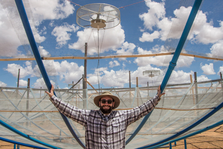 UC Berkeley astronomer Joshua Dillon under one of the HERA radio dishes in 2017. (Photo courtesy of Joshua Dillon) UC Berkeley astronomer Joshua Dillon under one of the HERA radio dishes in 2017. (Photo courtesy of Joshua Dillon)