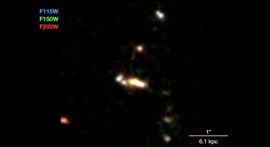 A group of small galaxies, seen almost 13 billion years back in time, likely in the process of forming a massive galaxy. The colors are composed from three different infrared colors. The white, horisontal bar shows the scale of approximately 20,000 lightyears. Credit: Shuowen Jin et al. (2023). A group of small galaxies, seen almost 13 billion years back in time, likely in the process of forming a massive galaxy. The colors are composed from three different infrared colors. The white, horisontal bar shows the scale of approximately 20,000 lightyears. Credit: Shuowen Jin et al. (2023).