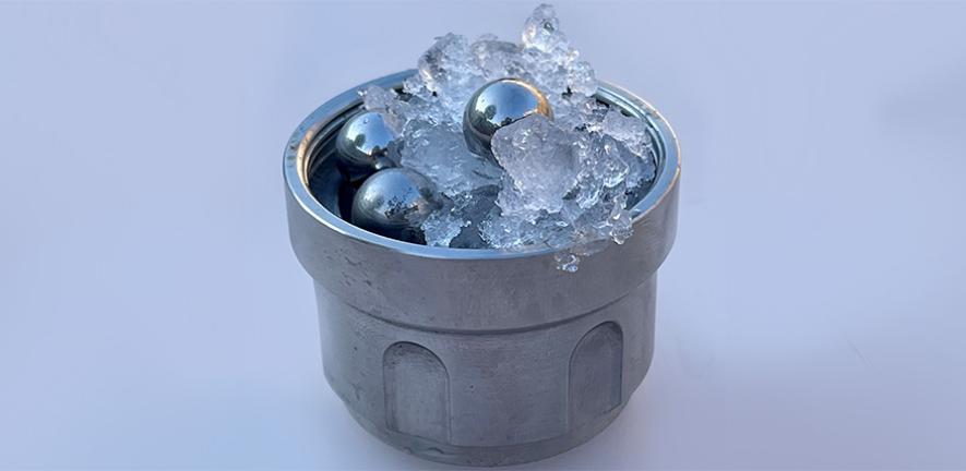 Part of the set-up for creating medium-density amorphous ice: ordinary ice and steel balls in a jar (not amorphous ice) Credit: Christoph Salzmann Part of the set-up for creating medium-density amorphous ice: ordinary ice and steel balls in a jar (not amorphous ice) Credit: Christoph Salzmann