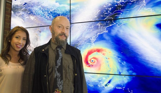CAPTION NASA tropical meteorologists Oreste Reale and Marangelly Fuentes pose with a hyperwall display of the Global Modeling and Assimilation Office's simulation of a hurricane. CREDIT Credits: NASA/Goddard/Deb McCallum CAPTION NASA tropical meteorologists Oreste Reale and Marangelly Fuentes pose with a hyperwall display of the Global Modeling and Assimilation Office's simulation of a hurricane. CREDIT Credits: NASA/Goddard/Deb McCallum