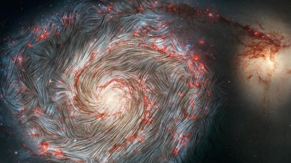The magnetic field in the Whirlpool Galaxy (M51), captured by NASA's flying Stratospheric Observatory for Infrared Astronomy (SOFIA) observatory superimposed on a Hubble telescope picture of the galaxy. The image shows infrared images of grains of dust in the M51 galaxy. Their magnetic orientation largely follows the spiral shape of the galaxy, but it is also being pulled in the direction of the neighboring galaxy at the right of the frame. (Credit: NASA, SOFIA, HAWC+, Alejandro S. Borlaff; JPL-Caltech, ESA, Hubble)