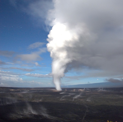 A gas and particle rich plume emanates from molten lava beneath Halemaʻumaʻu Crater on the Island of Hawaiʻi. The plume reacts and converts in the atmosphere, forming the acidic volcanic pollution locally known as “vog.” (photo credit: Michael Poland, USGS)